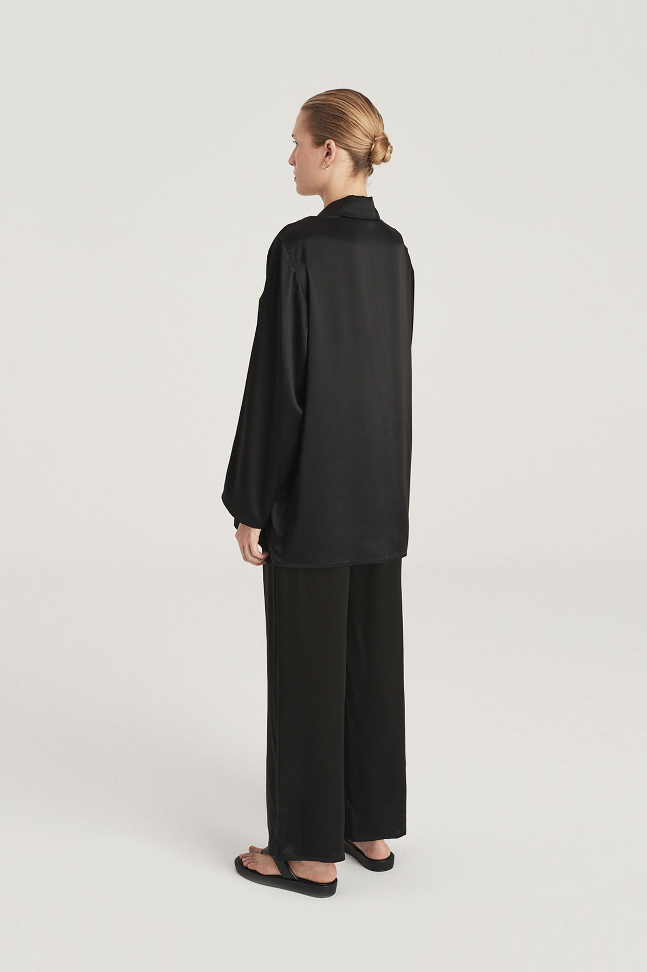 Silk satin pyjama set: black oversized shirt and wide leg pants