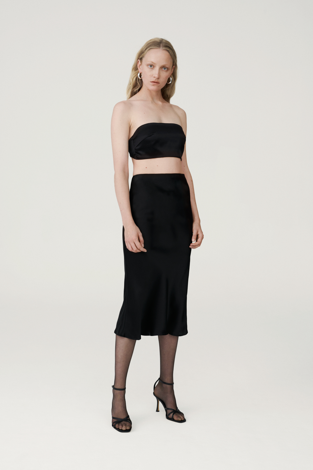 Black silk bralette top and mini satin skirt